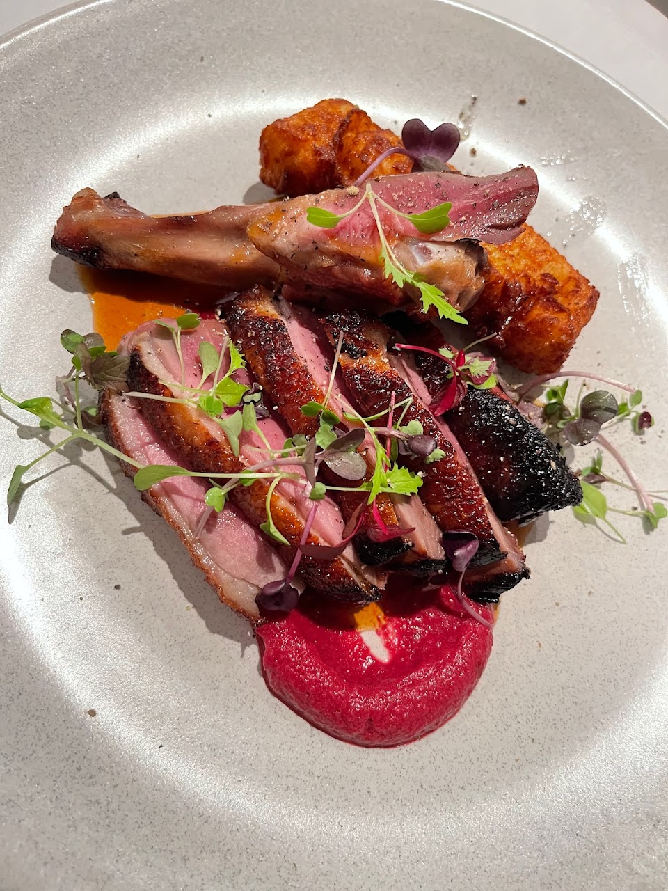 Plated lamb dish with garnish at Mazzaro Restaurant